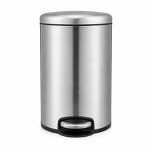 Load image into Gallery viewer, A cylindrical brushed stainless steel trash binwith a pedal mechanism. - side angle view